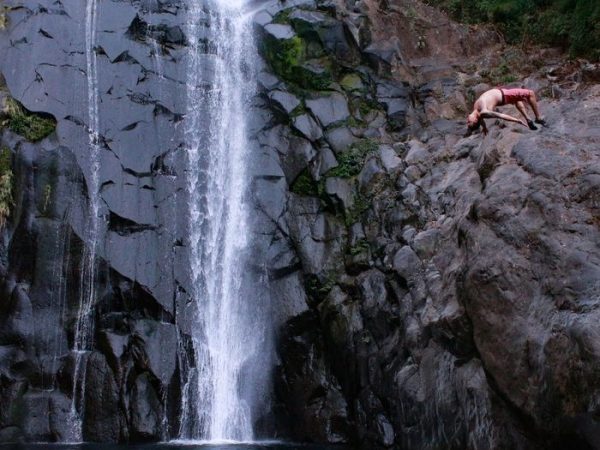 extreme waterfalls el salvador in ataco and national park el imposible west el salvador, man jumping off from a cliff or waterfall